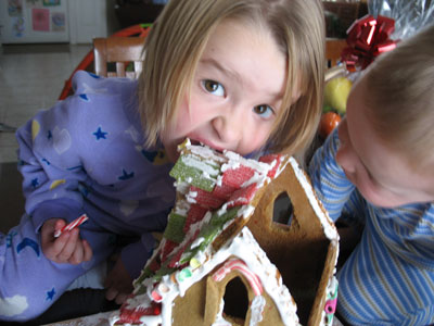 Victorian gingerbread house being eaten